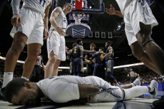 Xavier Musketeers forward Naji Marshall (13) remains on the floor after being fouled in the first half of the NCAA Big East basketball game between the Xavier Musketeers and the Marquette Golden Eagles at the Cintas Center in Cincinnati on Wednesday, Jan. 29, 2020.