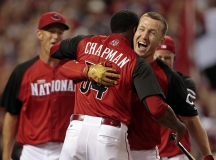 Aroldis Chapman runs to hug Todd Frazier as he wins the Home Run Derby at Great American Ballpark in downtown Cincinnati on Monday, July 13, 2015.