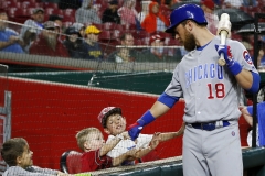 Chicago Cubs left fielder Ben Zobrist (18) first bumps with young fans behind the plate before the first inning of the MLB National League game between the Cincinnati Reds and the Chicago Cubs at Great American Ball Park in downtown Cincinnati on Friday, May 18, 2018. After three innings the Cubs led 4-0.