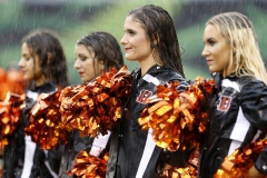 The Ben-Gals cheerleaders perform as heavy rain fans before kick off of the first quarter of the NFL Week 5 game between the Cincinnati Bengals and the Buffalo Bills at Paul Brown Stadium in downtown Cincinnati on Sunday, Oct. 8, 2017.