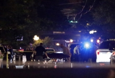 Officials load a body bag into van at the scene of a deadly mass shooting in the Oregon District area of Dayton, Ohio, on Sunday, Aug. 4, 2019. Ten people are dead, including the suspected shooter, and 26 are injured after shooting broke out in Dayton's Oregon District. The suspected used a .223 caliber rifle and was found wearing body armor and multiple spare magazines, according the the city's mayor Nan Whaley. Dayton Police on patrol in the entertainment district responded and neutralized the shooter in less than one minute, the mayor said.