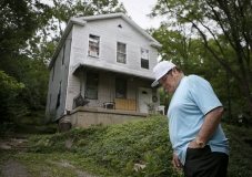 Major League Baseball's all-time hits leader Pete Rose reminisces with Enquirer writer Paul Daugherty as he walks around the front of his childhood home in the Riverside neighborhood of Cincinnati, on Tuesday, June 2, 2015. Rose spoke candidly about his upbringing near the banks of the Ohio River, his family, multi-sport youth career and the lesson's of his father he credits with making him the player he was.