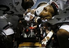 The Cincinnati Bearcats celebrate with the Victory Bell after the fourth quarter of the NCAA college football game between the Miami Redhawks and the Cincinnati Bearcats at Yager Stadium in Oxford, Ohio, on Saturday, Sept. 16, 2017. The Bearcats won 21-17 after an intercepted RedHawks pass was returned for a touchdown with just over one minute remaining in the game. UC retains the Victory Bell for the 12th-straight year.