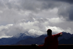 Cincinnati Reds designated hitter Matt Kemp (27) long tosses silhouetted in front of a snow-capped Estrella Mountain top at the Cincinnati Reds spring training facility in Goodyear, Ariz., on Friday, Feb. 22, 2019.